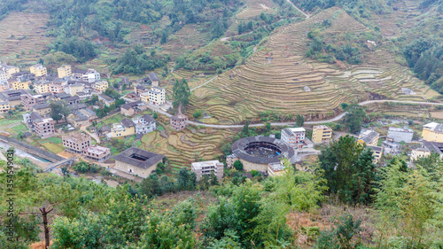 Aerial view of Fujian landscape with Tulou and rice plantation.