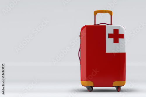 Tonga flag on a stylish suitcases back view on color background. Space for text. International travel and tourism concept. 3D rendering. photo