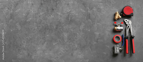 Obraz na płótnie Flat lay composition with plumber's tools and space for text on grey background