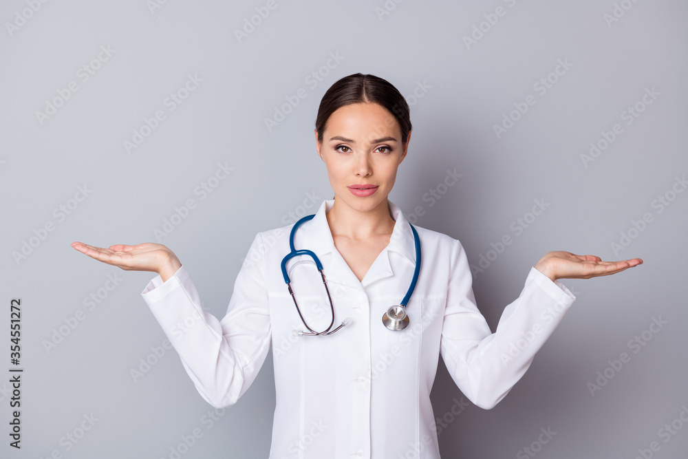 Photo of attractive doc professional hold two open palms empty space advising good quality vitamins pick select one better wear medical uniform lab coat stethoscope isolated grey background Photo of attractive doc professional hold two open palms empty space advising good quality vitamins pick select one better wear medical uniform lab coat stethoscope isolated grey background