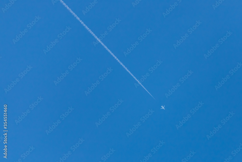 Plane in the blue sky