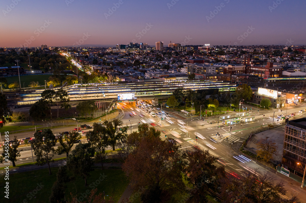 Fototapeta premium Aerial night view of Richmond station and Hoddle Street in Melbourne, Australia