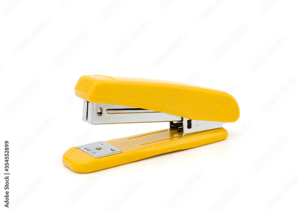 A yellow stapler on white background. Clipping path A yellow stapler on white background. Clipping path