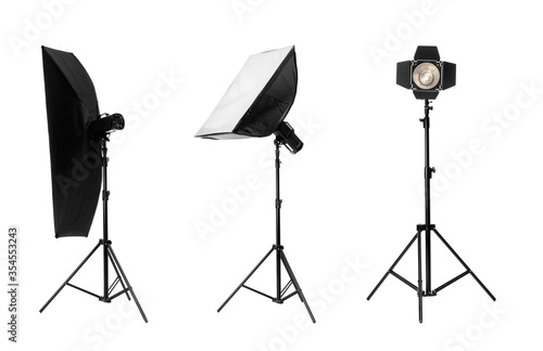 Set with different studio lightings on white background photo