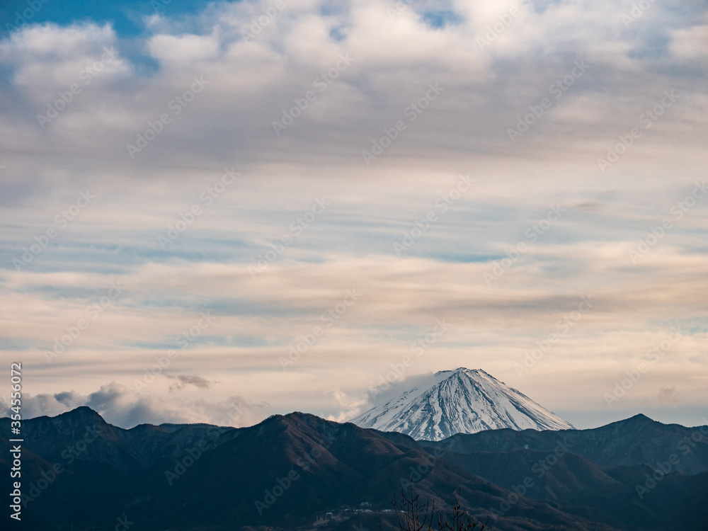 The tip of Mt. Fuji rising above the surrounding mountains The tip of Mt. Fuji rising above the surrounding mountains