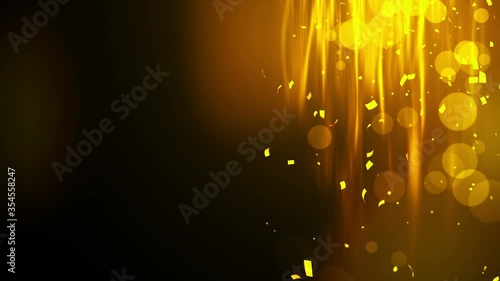 Falling shiny golden confetti. Bright festive tinsel of gold color. Bokeh lights on black background. Shining waves design. Loop animation. Copy space for text.