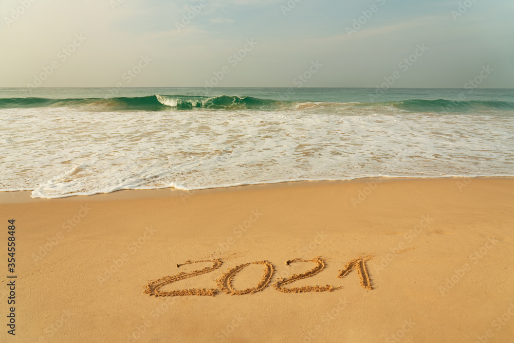 Sand beach with 2021 New Year symbol and blue waves, Sri Lanka Sand beach with 2021 New Year symbol and blue waves, Sri Lanka