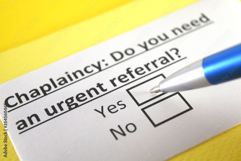 One person is answering question about chaplaincy. One person is answering question about chaplaincy.