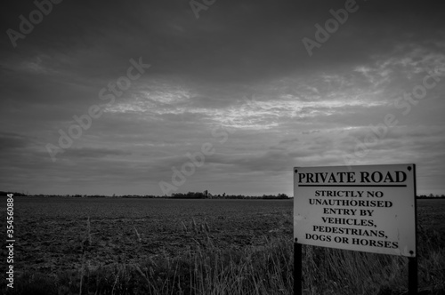 A sign forbidding entry to everything against a bleak backdrop and foreboding sky