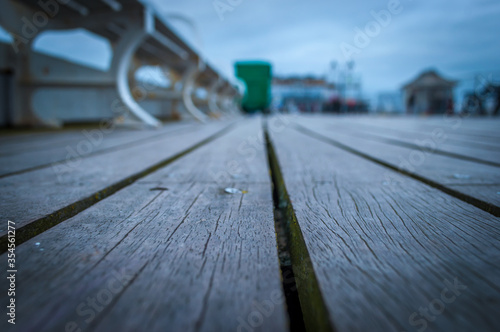 A low down narrow depth of field view of the deck of Cromer Pier in Norfolk