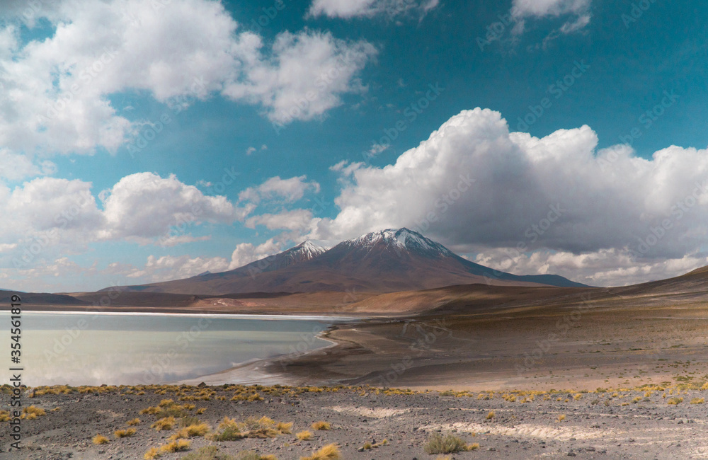 Landscape mountain Water Lake. Dry, Barren desert, snowcapped mountains wilderness. Mountain range view. Salt Flats, Uyuni, Bolivia. Copy space, Rocks, blue sky, nature, hiker, hiking Landscape mountain Water Lake. Dry, Barren desert, snowcapped mountains wilderness. Mountain range view. Salt Flats, Uyuni, Bolivia. Copy space, Rocks, blue sky, nature, hiker, hiking