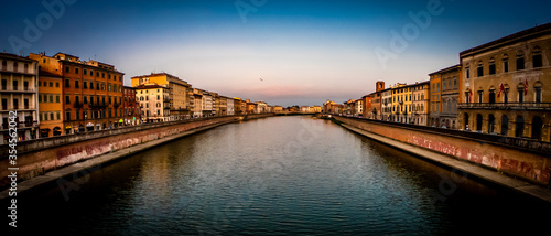 Tableau sur toile Pisa, Tuscany, Italy Arno riverscape view from bridge at sunset