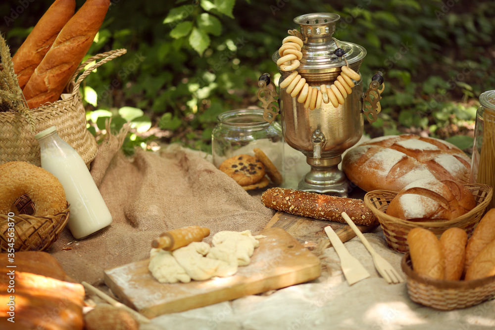 Healthy eating concept. Summer picnic outdoors in summer on a sunny day. Ingredients for making bread: flour, milk.