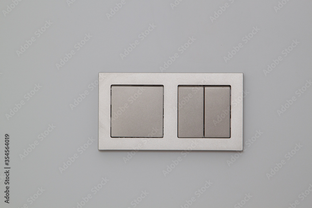 modern stylish champagne light switch on a grey wall modern stylish champagne light switch on a grey wall