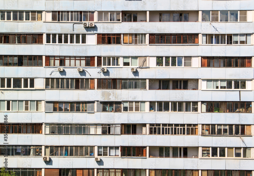 facade of multi-storey building with different balconies in residential area facade of multi-storey building with different balconies in residential area