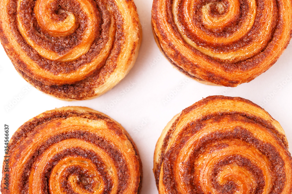 Danish cinnamon buns or cinnabons. Sweet, homemade pastry Danish cinnamon buns or cinnabons. Sweet, homemade pastry