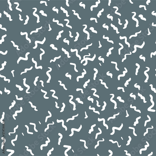 Seamless vector pattern with little waves. Wavy freehand scribbles in Memphis style. Thin lines, dashes, and smears. Grayscale retro mosaic texture. Hand-drawn grunge ink vector illustration