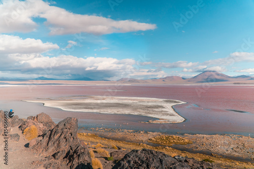 Red Lake mountain landscape, Bolivia. Beautiful coloured water, with mountains background, and unique scenic view. Flamingos in the lake. Shot in Uyuni, Salar de Uyuni, South America.