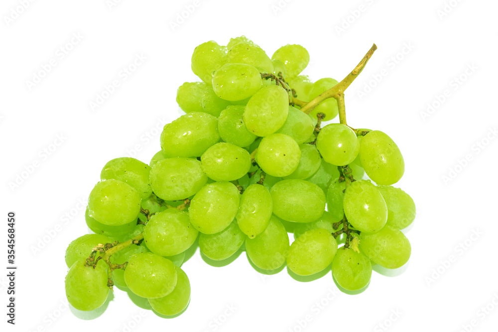 Extraordinarily sweet grapes with yellow green fruits on a white background