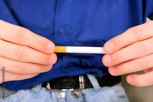 person hold a cigarette