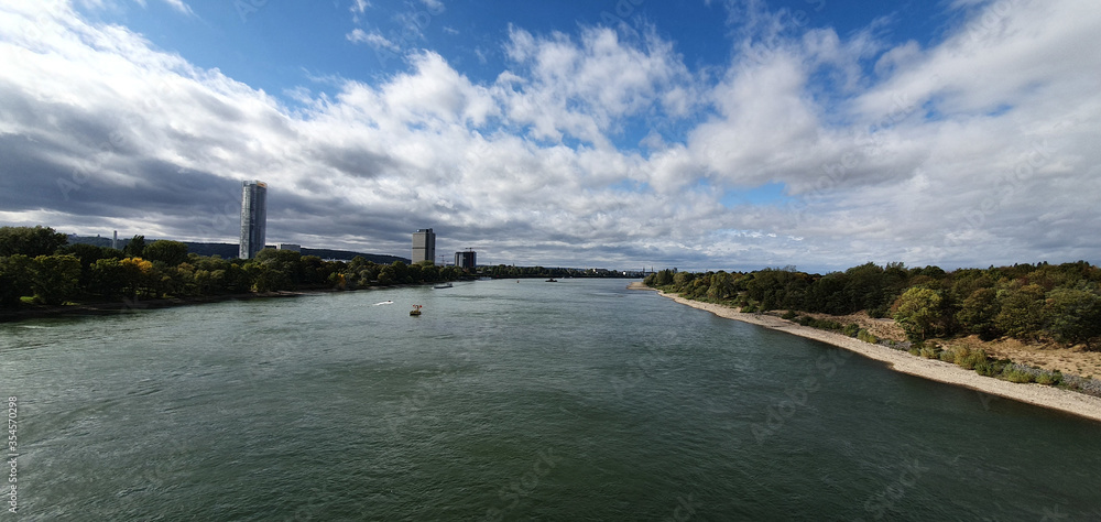 Bonn Germany end of September 2019 afternoon photographed from the Südbrücke southern bridge in northern direction, the Rhine. both sides of the bank and skyline Bonn can be seen in beautiful weather