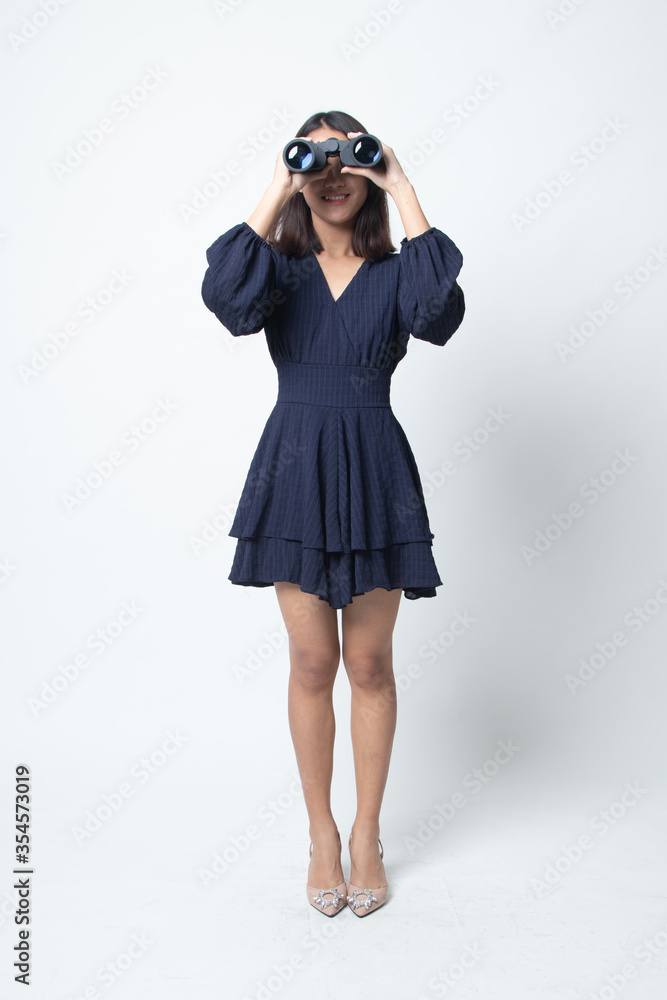 Full body of young Asian woman with binoculars. Full body of young Asian woman with binoculars.
