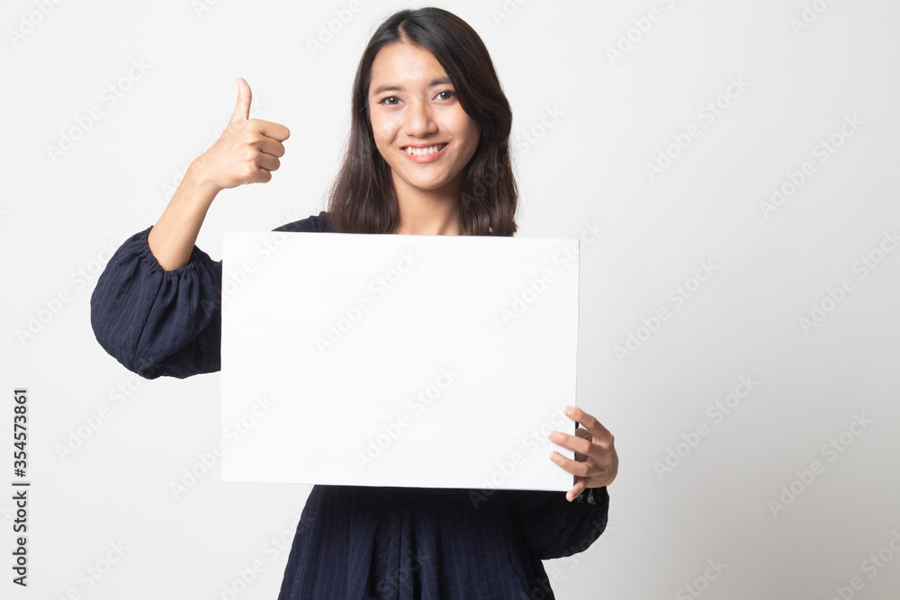 Young Asian woman show thumbs up with white blank sign. Young Asian woman show thumbs up with white blank sign.