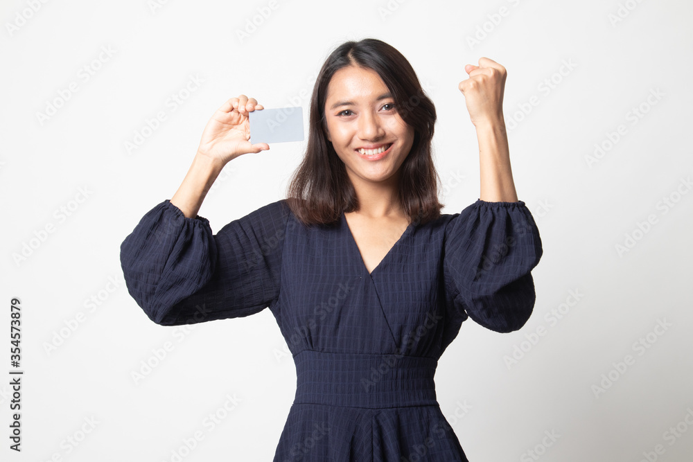 Young Asian woman fist pump with blank card. Young Asian woman fist pump with blank card.