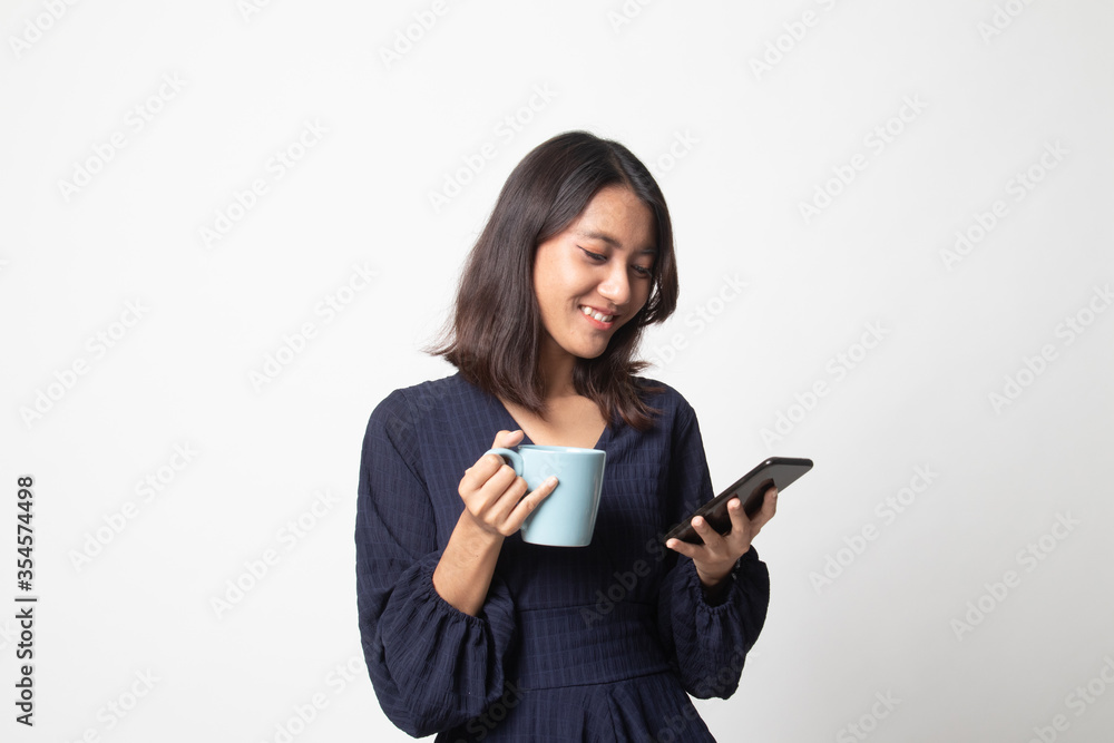 Young Asian woman with mobile phone and coffee cup. Young Asian woman with mobile phone and coffee cup.