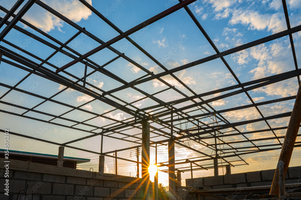 Structural steel roof using steel frames of building residential at evening Structural steel roof using steel frames of building residential at evening