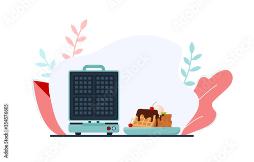 Waffle maker and plate of belgian waffles with chocolate topping and cherry