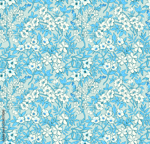 Trendy seamless vector floral pattern. Endless print of light blue flowers, leaves and berries. Summer and spring motifs in blue tones.  Vector illustration.