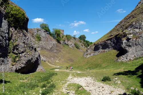 Cave Dale pass overlooked by Peveril Castle, Castleton in the heart of the Derbyshire's Peak District photo