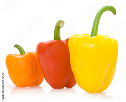 red orange yellow peppers on the white background