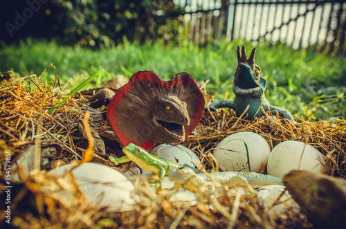 Toy dinosaurs and their nest