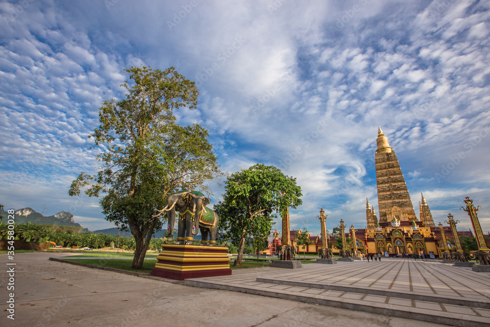The beautiful sculpture background of, Wat Bang Thong, surrounded by trees, has a large area, is a religious tourist attraction in Krabi, with tourists always visiting, Thailand