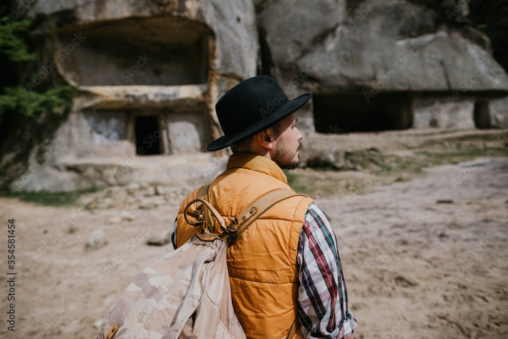 Portrait of a young traveler in the mountains. Thirst for adventure Portrait of a young traveler in the mountains. Thirst for adventure