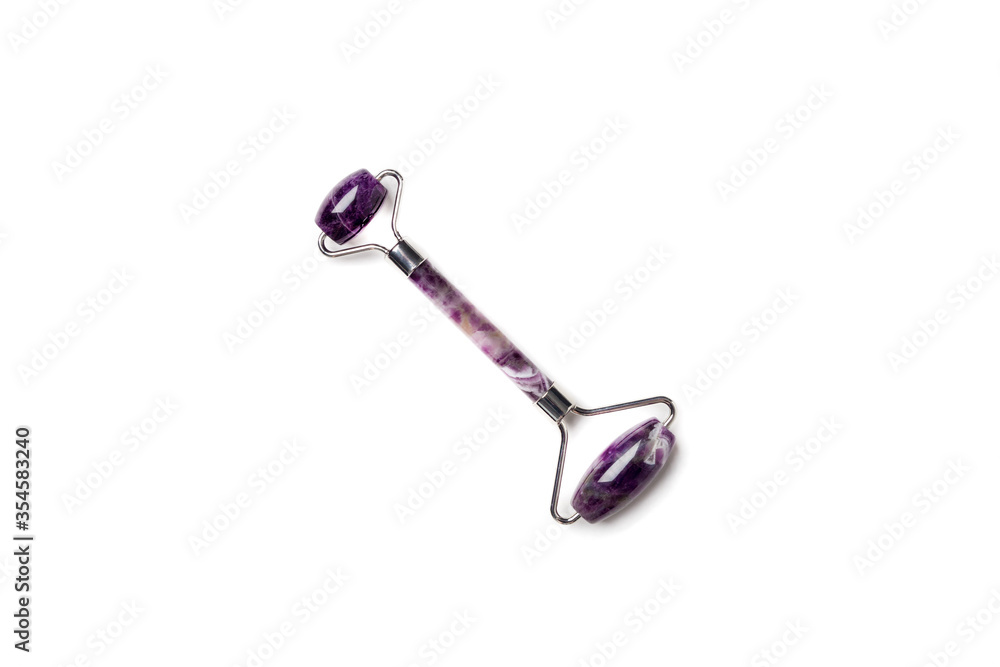 Purple jade lifting roller for face massage isolated on white Purple jade lifting roller for face massage isolated on white