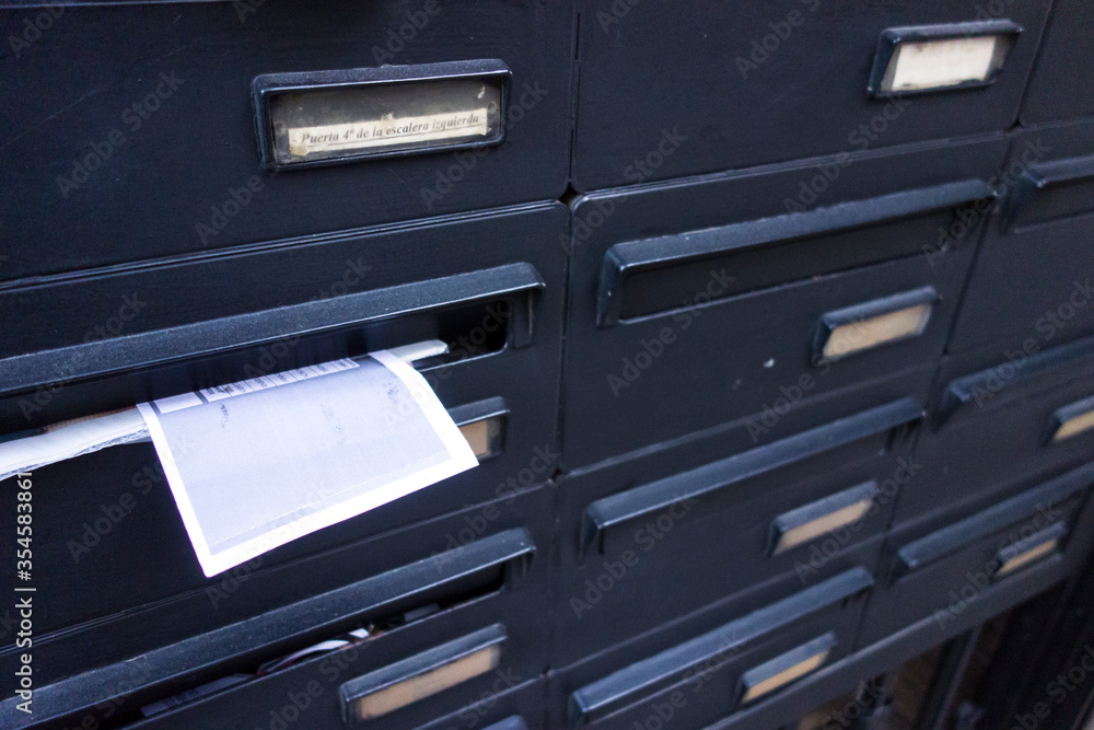 black letterbox on the street outside black letterbox on the street outside