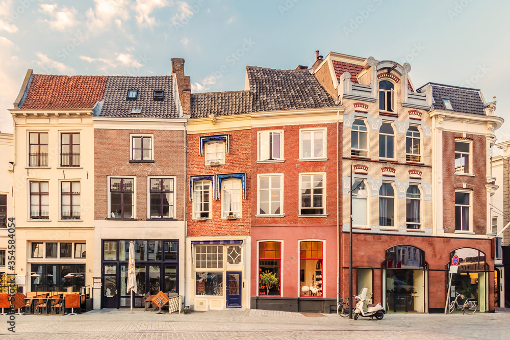 View at a historic square with bars, restaurants and shops in the ancient city center of the Dutch city of Zutphen