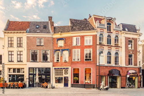 View at a historic square with bars, restaurants and shops in the ancient city center of the Dutch city of Zutphen
