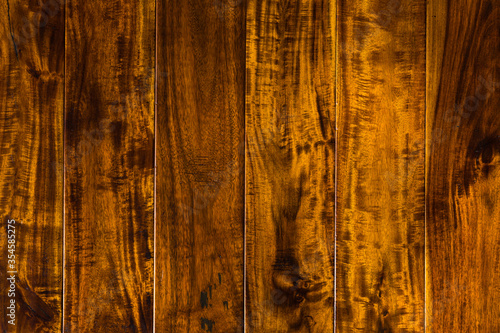 parquet from solid Sucupira wood (Bowdichia Nitida Benth or more commonly known as Brazilian Chestnut). sample of parquet. texture or background. wood texture. board. painted with natural oil. wax.  photo