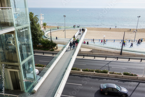 pedestrian bridge that crosses the road to Alicante beach
