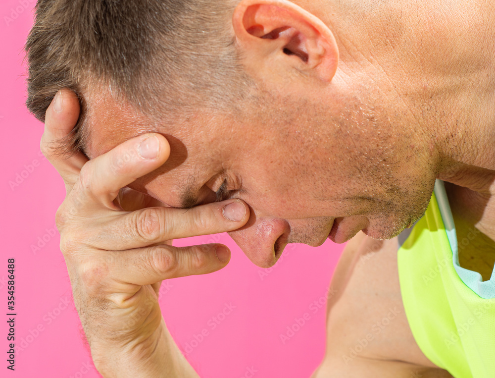 Obraz premium Sad tired man suffering from headache