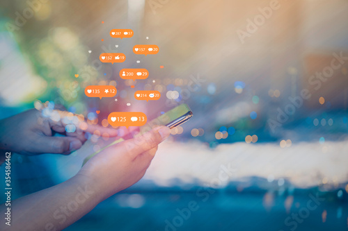 Businessman using a social media marketing concept with notification icons with Investors are calculating on calculator investment costs, business finance concept.