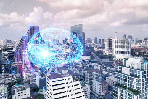 Brain hologram over panorama city view of Bangkok  the largest science hub in Asia. The concept of developing coding and high-tech science. Double exposure.