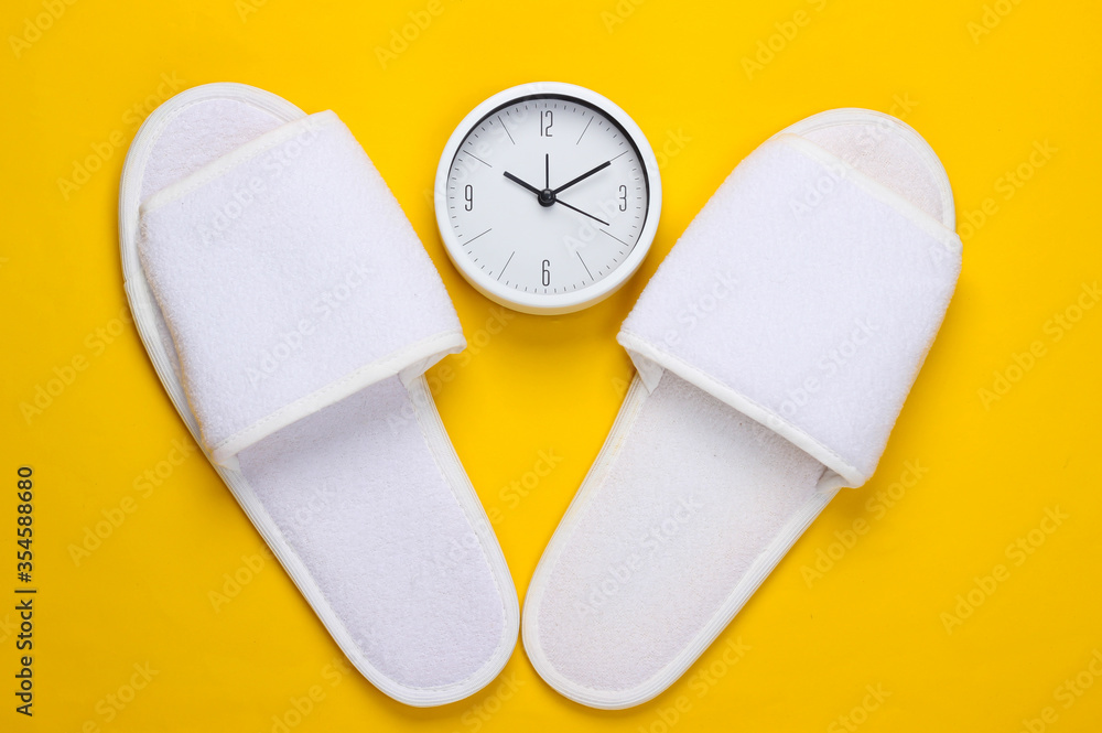 browser van mening zijn Republiek Time to sleep. Sleeping Slippers and Clock on a yellow background. Top view  Stock Photo | Adobe Stock
