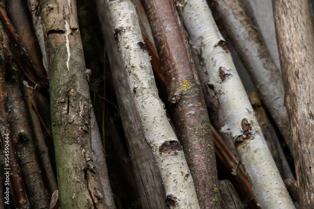 Wooden sticks for a rustic fence. Firewood. Wooden sticks for a rustic fence. Firewood.