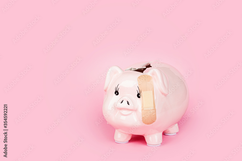 Broken Piggy bank on pink background. mockup, template. Concept of financial crisis after coronavirus covid-19 pandemic
