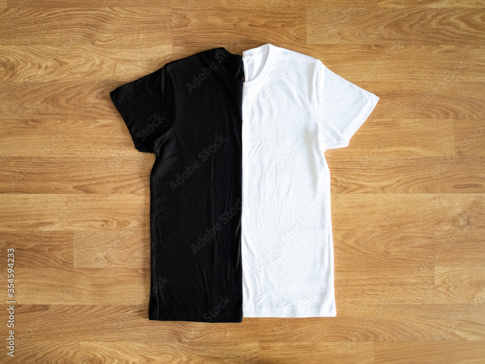 custom made wallpaper toronto digitalFolded black and white T-shirts on wooden floor